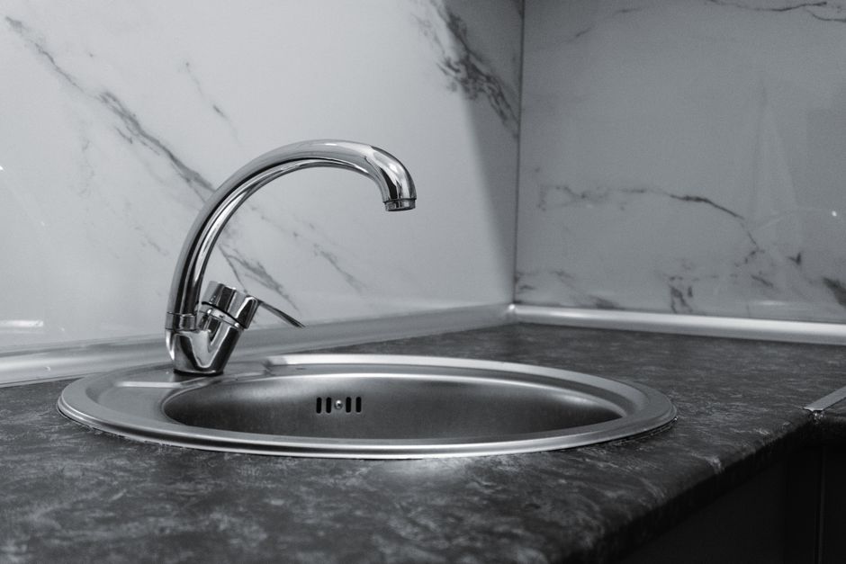Modern stainless steel kitchen sink and fixture integration